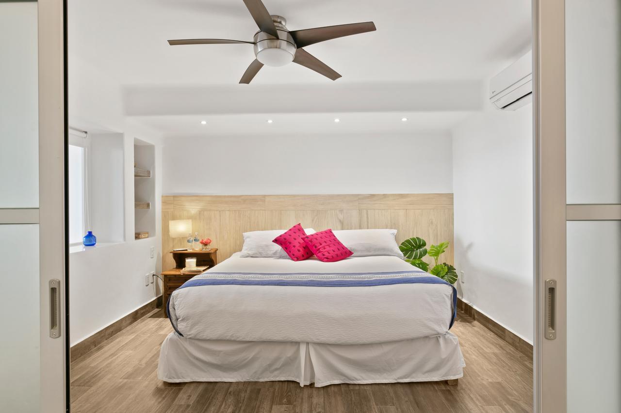 Master bedroom with King bed in the Two-Bedroom Lagoon View Suite at Casa Tortugas Boutique Hotel